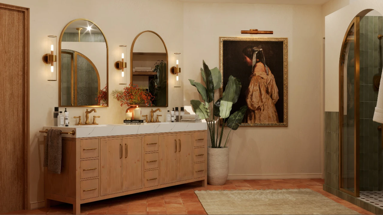 Warm plaster bathroom with a white oak double vanity, arched brass mirrors, and a terracotta tile floor