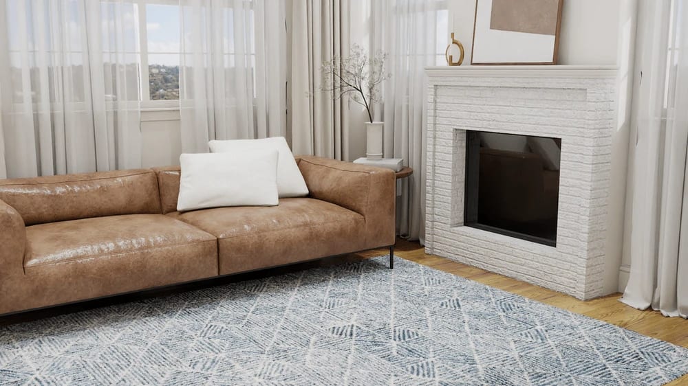 Contemporary living room with tan leather sofa on the abstract blue rug