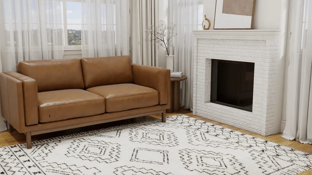 Cozy living room with tan leather loveseat on the geometric rug