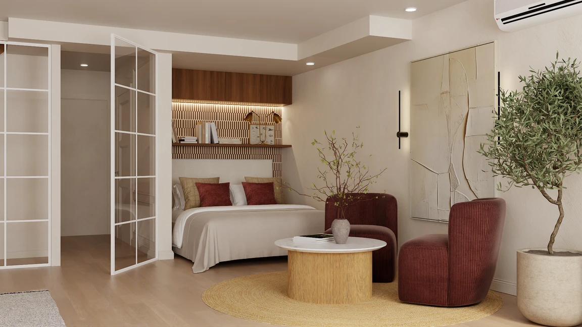 White framed grid glass doors separating the bed alcove from the rest of the open plan room