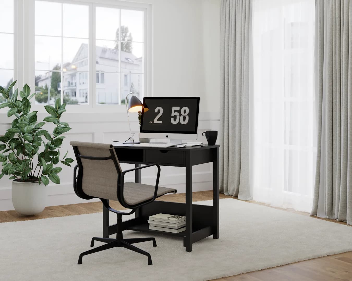 Compact black desk with center drawer and open lower shelf in a bright office