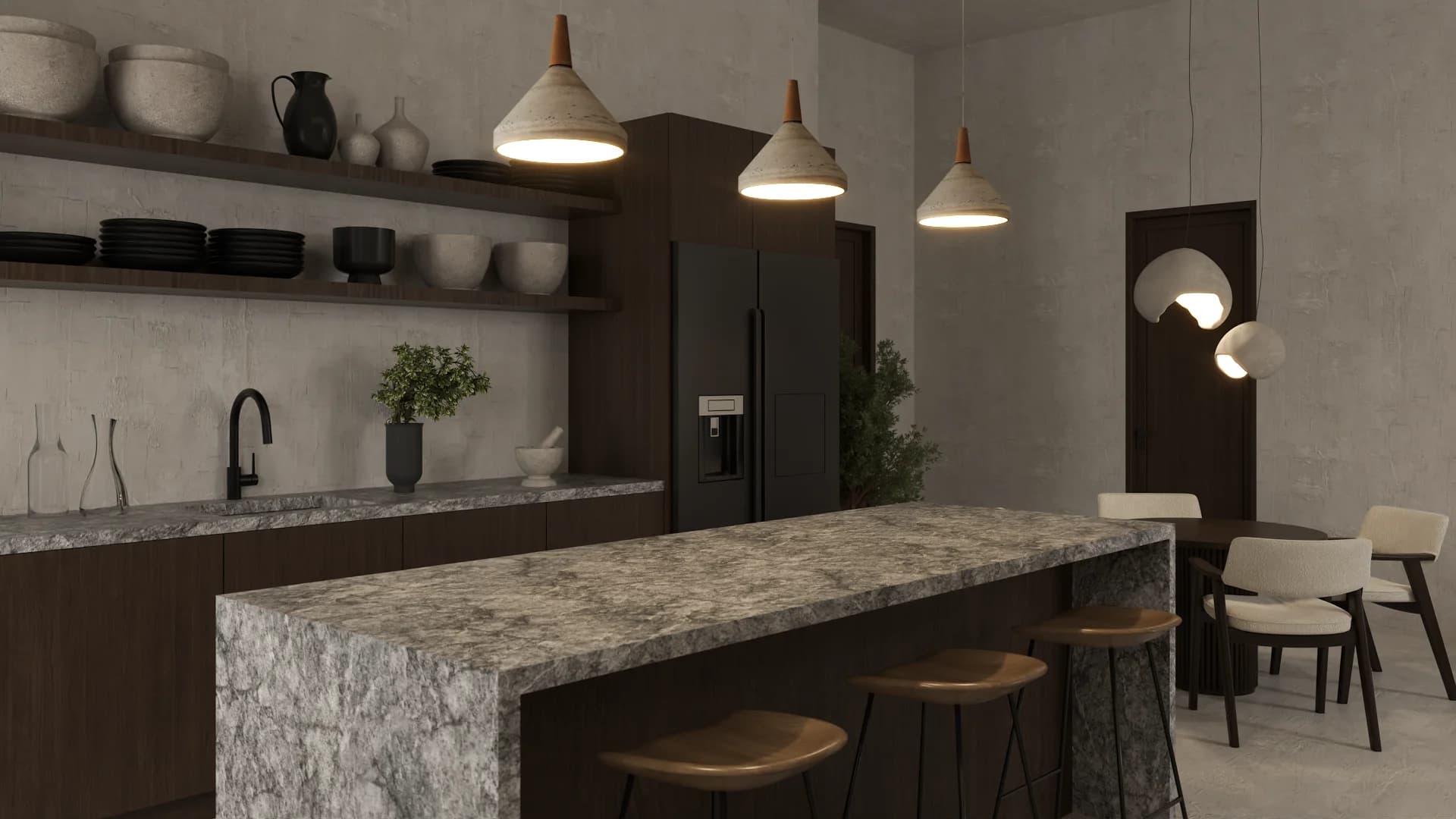 Close view of granite waterfall island, woven dome pendants, dark cabinets, and refrigerator wall.