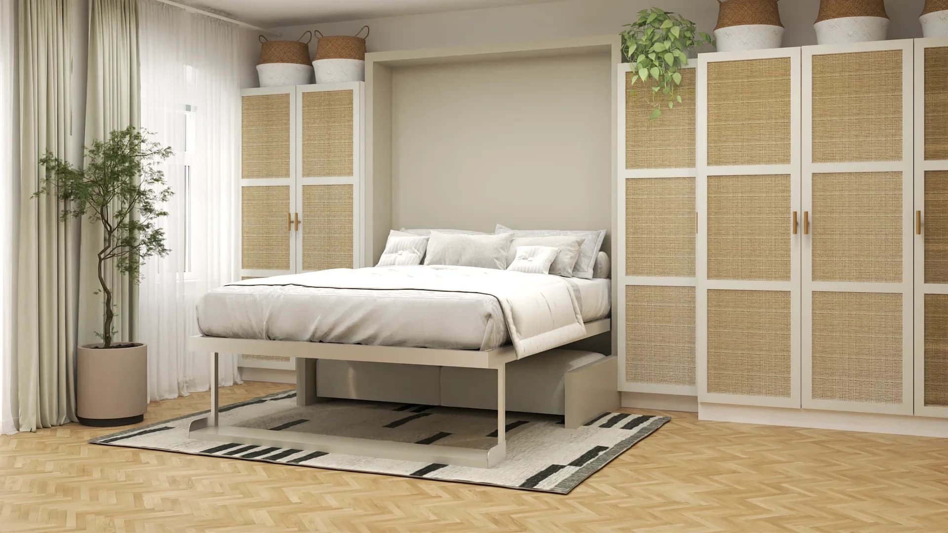Murphy bed pulled down in studio apartment showing full bed with white linens, under-bed storage drawers, rattan wardrobes on both sides, herringbone parquet floor and woven basket decor