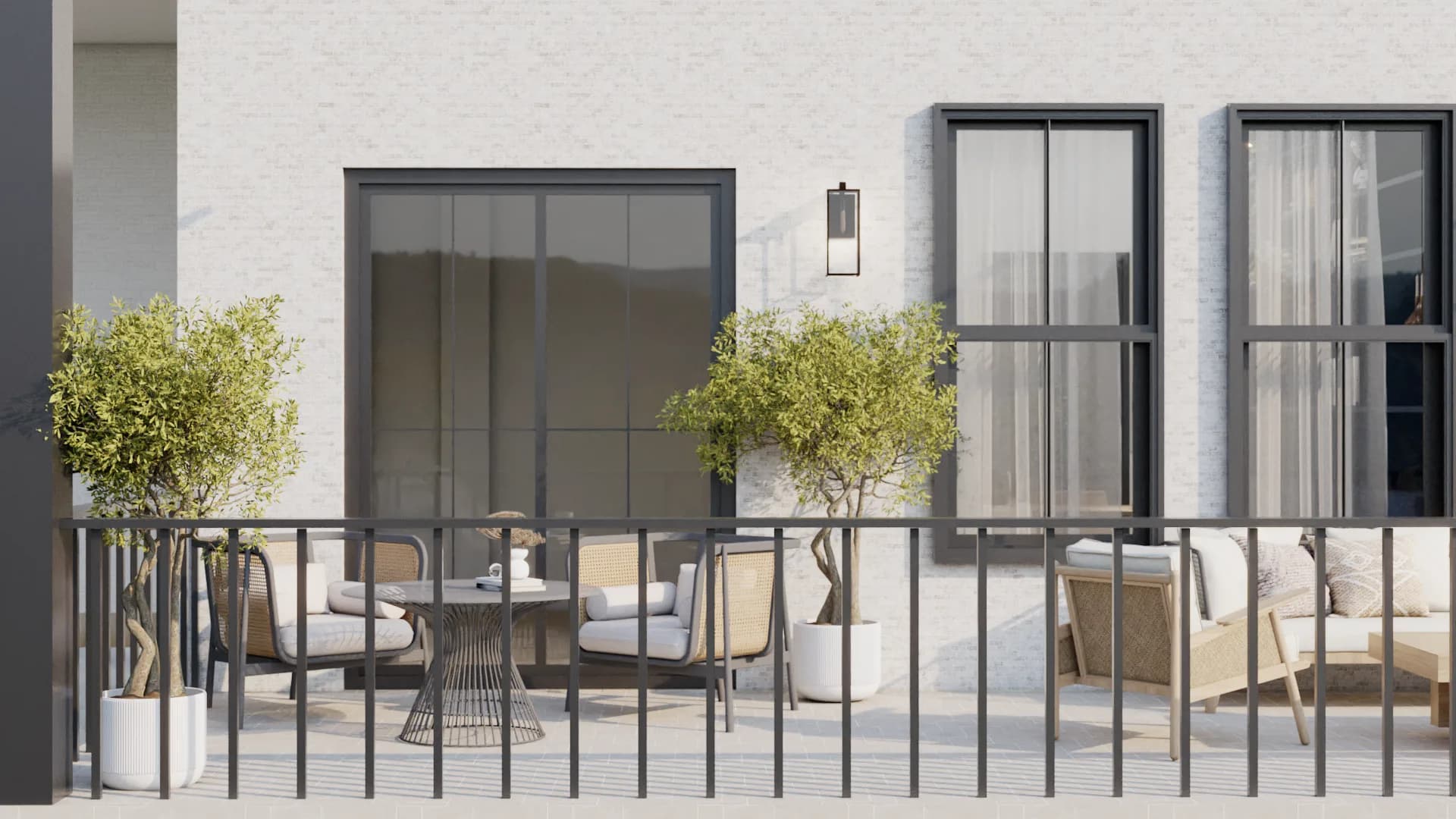 Terrace dining set and lounge seating with olive trees and wall sconce