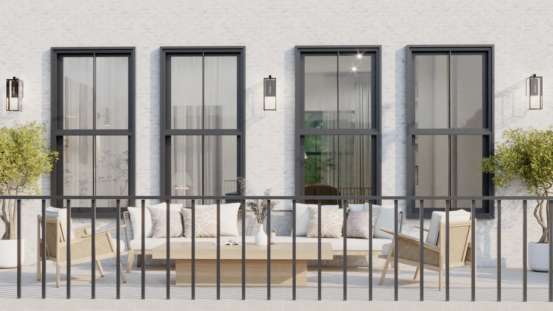 Modern terrace with white brick facade, black-frame windows, rattan lounge sofa, wall-mounted lantern sconces, and olive trees