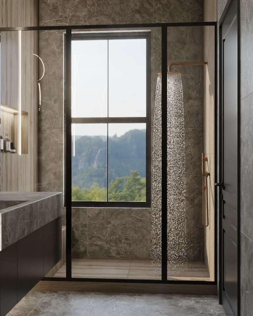 Brass rain shower with active water flow inside glass partition, mountain view through window