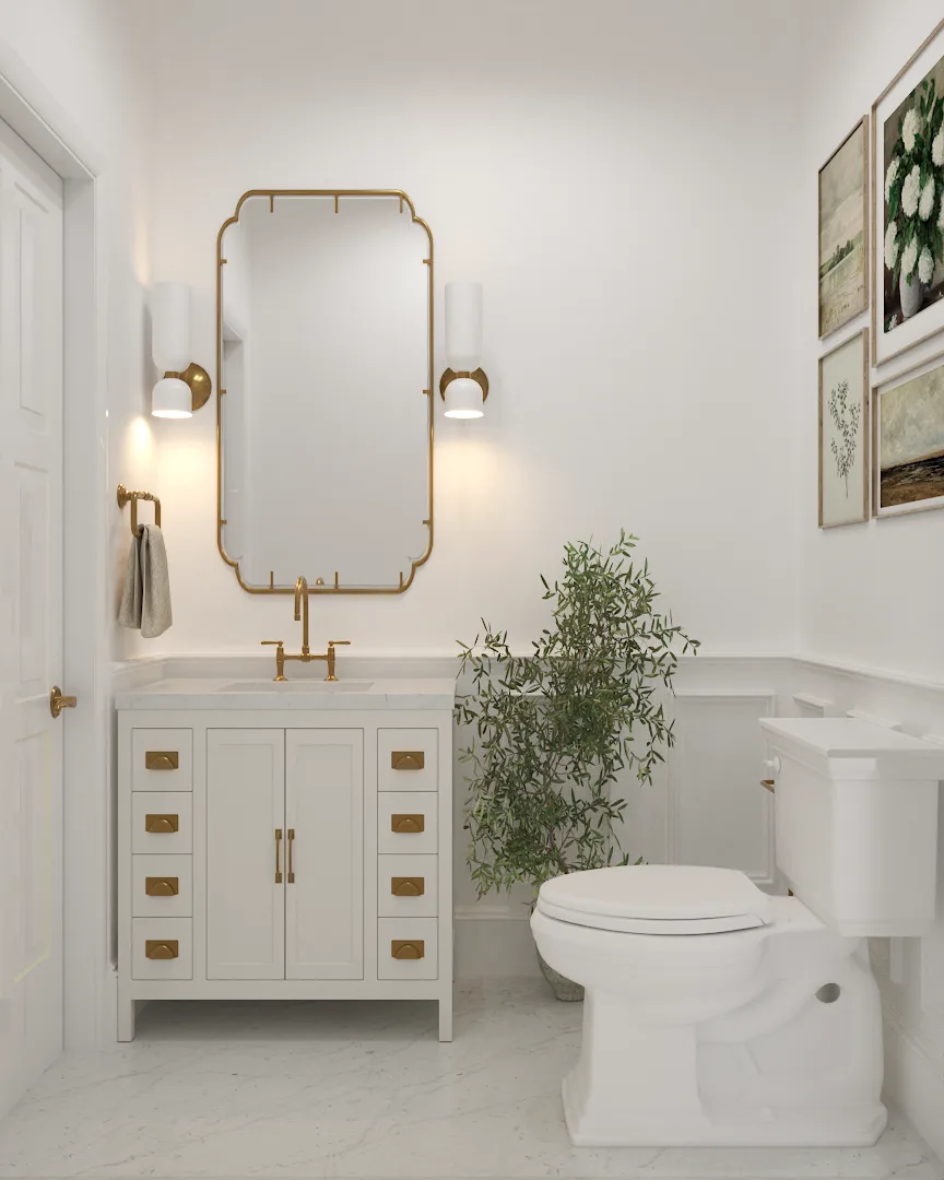 White campaign vanity with brass cup-pull hardware, scalloped gold mirror, cylinder sconces, and marble hex tile