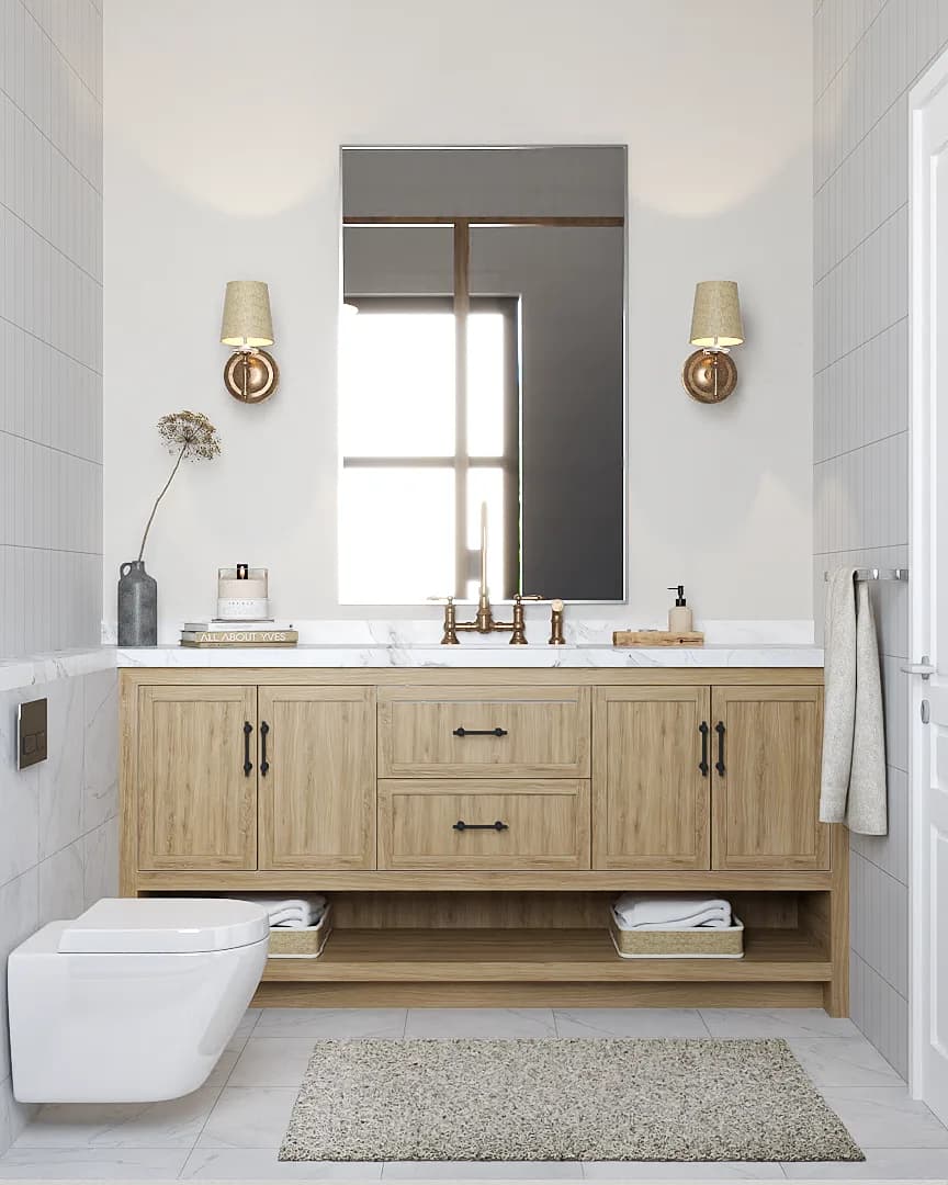 White subway tile bathroom with natural oak double vanity, marble countertop, brass widespread faucet, and paired linen wall sconces flanking rectangular mirror.