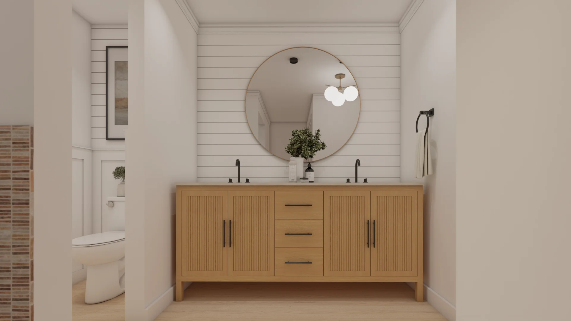 Fluted oak double vanity with round brass mirror on white shiplap wall, matte black faucets and globe pendant light