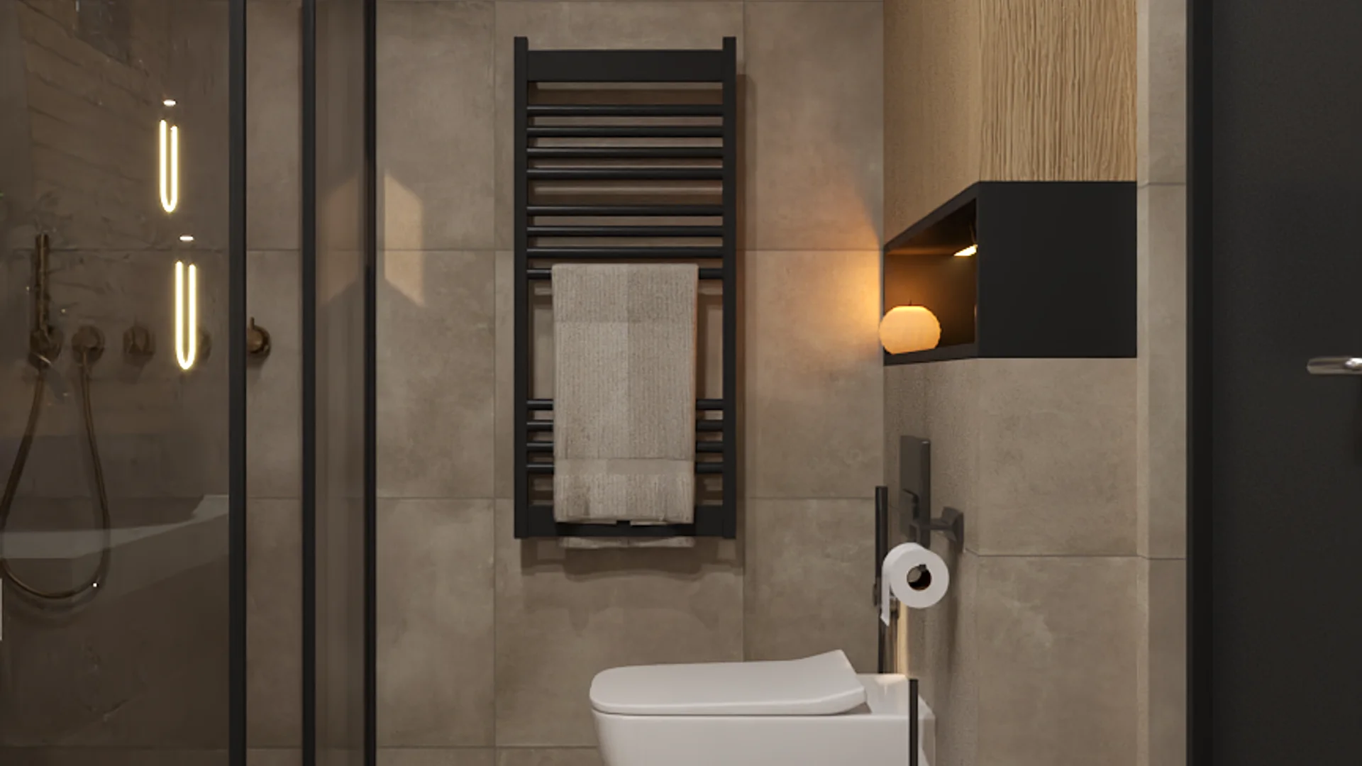 Contemporary bathroom with black-framed glass shower partition, brass fixtures, vertical LED sconces, wall-mounted toilet, black towel radiator with linen towel, floating black shelf with globe sconce, and beige stone-look tiles