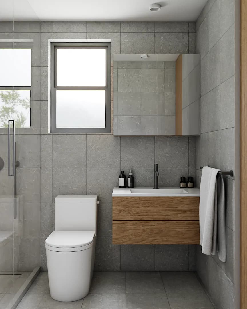 Floating oak vanity with undermount sink, black faucet, mirror cabinet, and gray stone tile walls