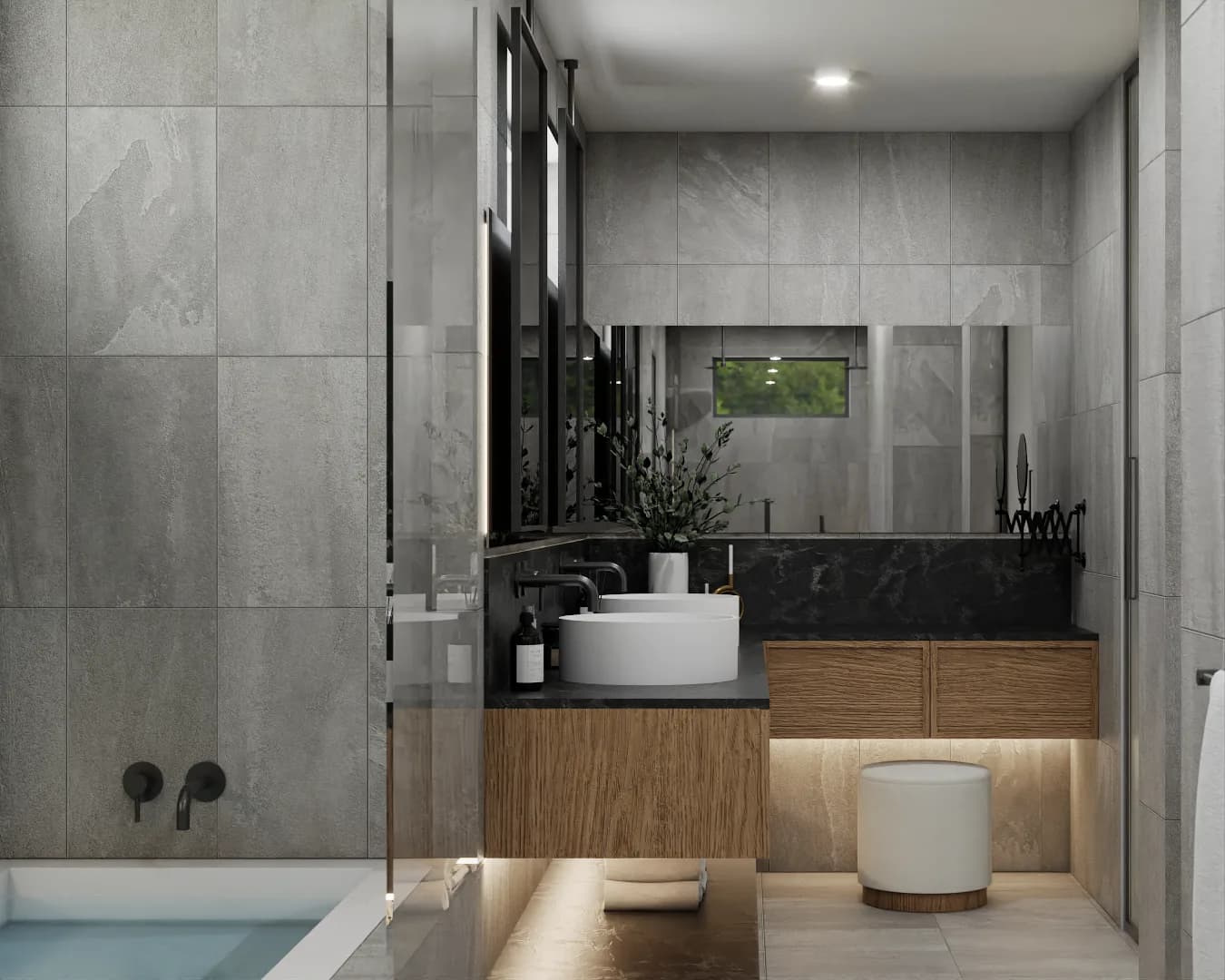 Bathroom vanity with dark charcoal countertop, vessel sink, black faucet, and oak cabinet with LED