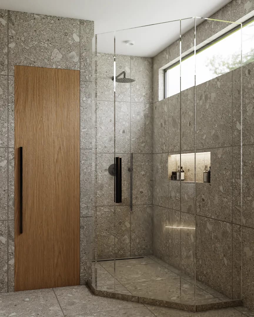 Frameless glass shower with terrazzo walls, rain head, recessed niche, and oak panel door