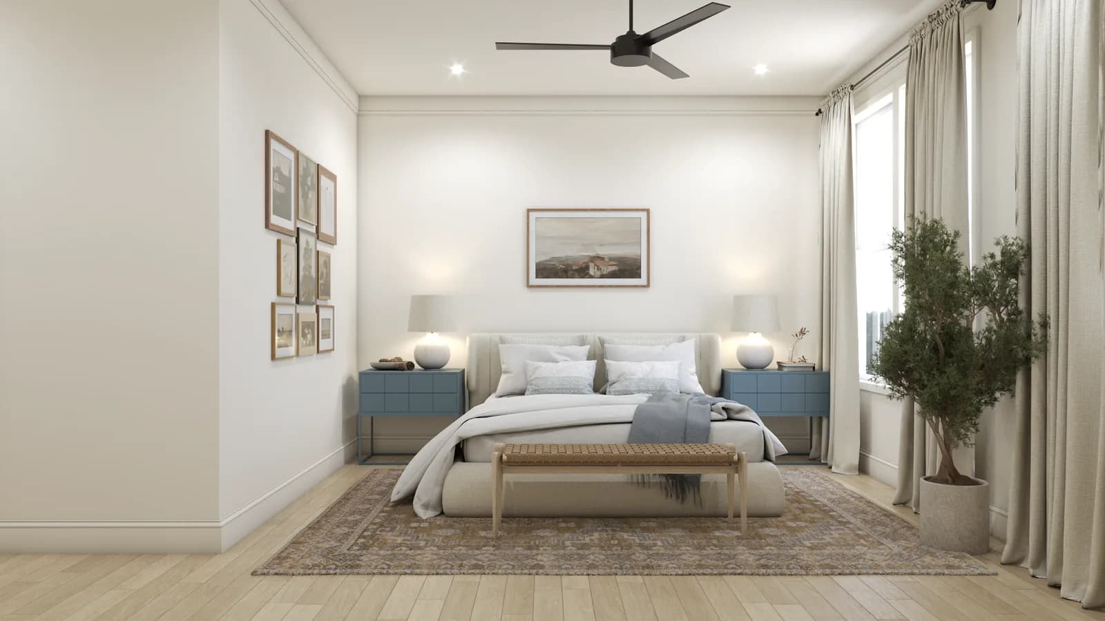 Transitional bedroom with dusty blue nightstands, upholstered platform bed, gallery wall art, and black ceiling fan over vintage rug