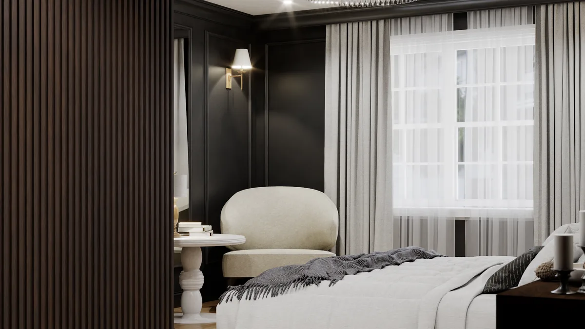 Sitting nook from bed angle showing dark slat wall, barrel chair, and sheer curtains