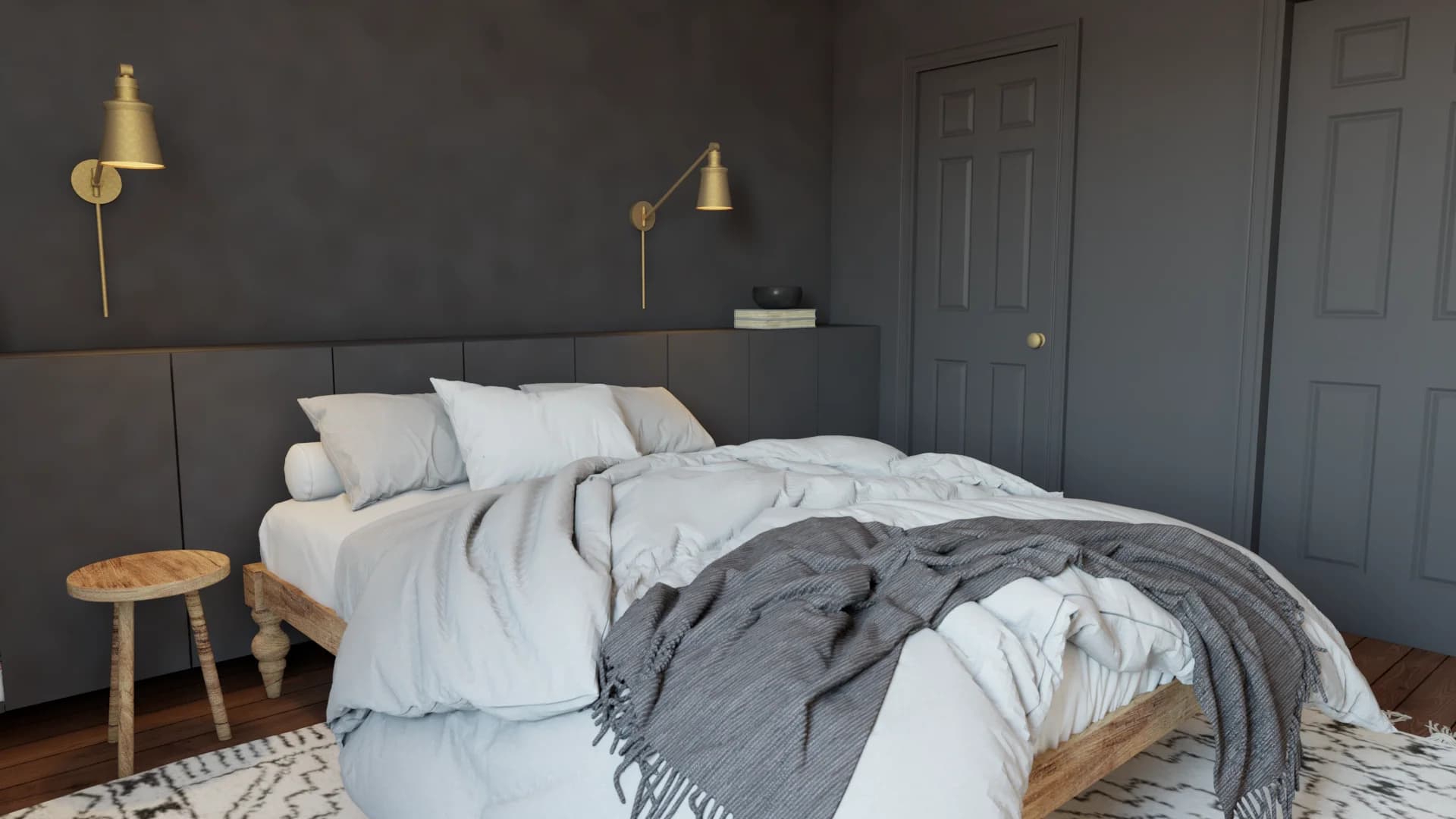Dark gray bedroom with brass wall sconces, wood platform bed, white linen, and woven throw