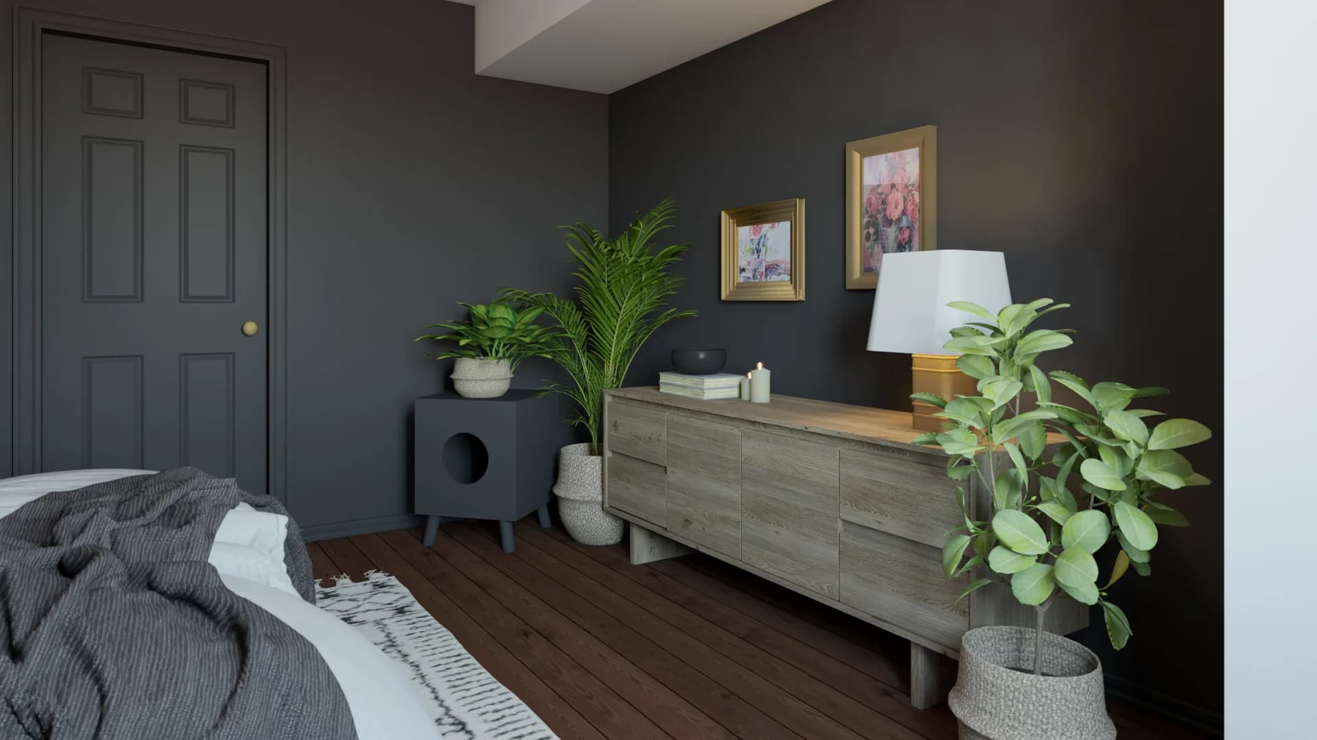 Dark charcoal bedroom corner with wood dresser, gold-framed art, and potted tropical plants