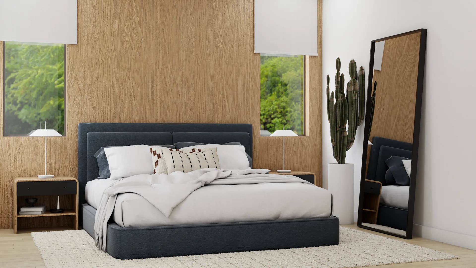 Wide view of navy bed oak panel bedroom with tall lean mirror, cactus, and both nightstands