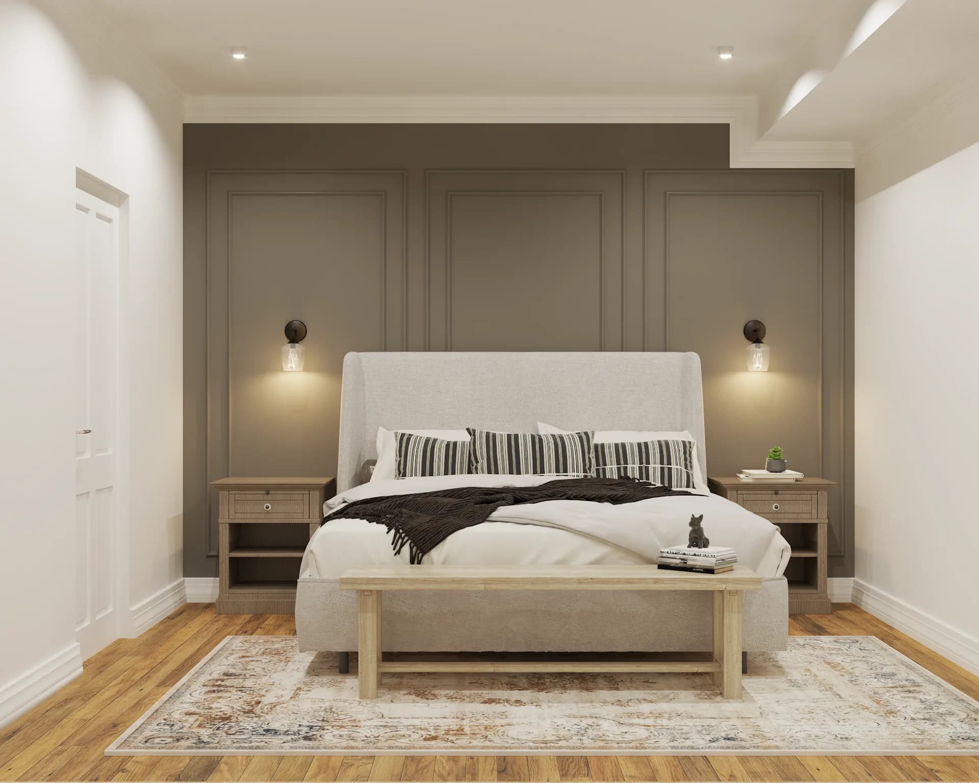 Front view of olive green paneled wall with centered bed, sconces, and bench