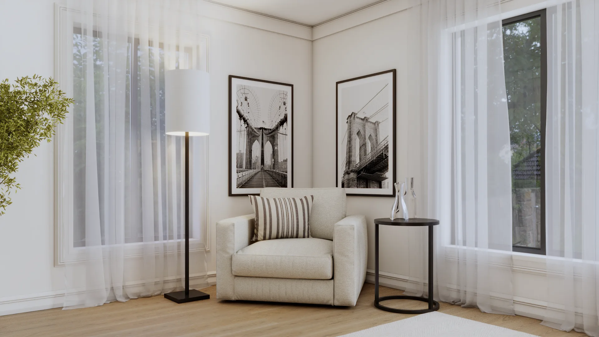 Cream armchair with striped pillow and black and white bridge photography prints in bedroom corner