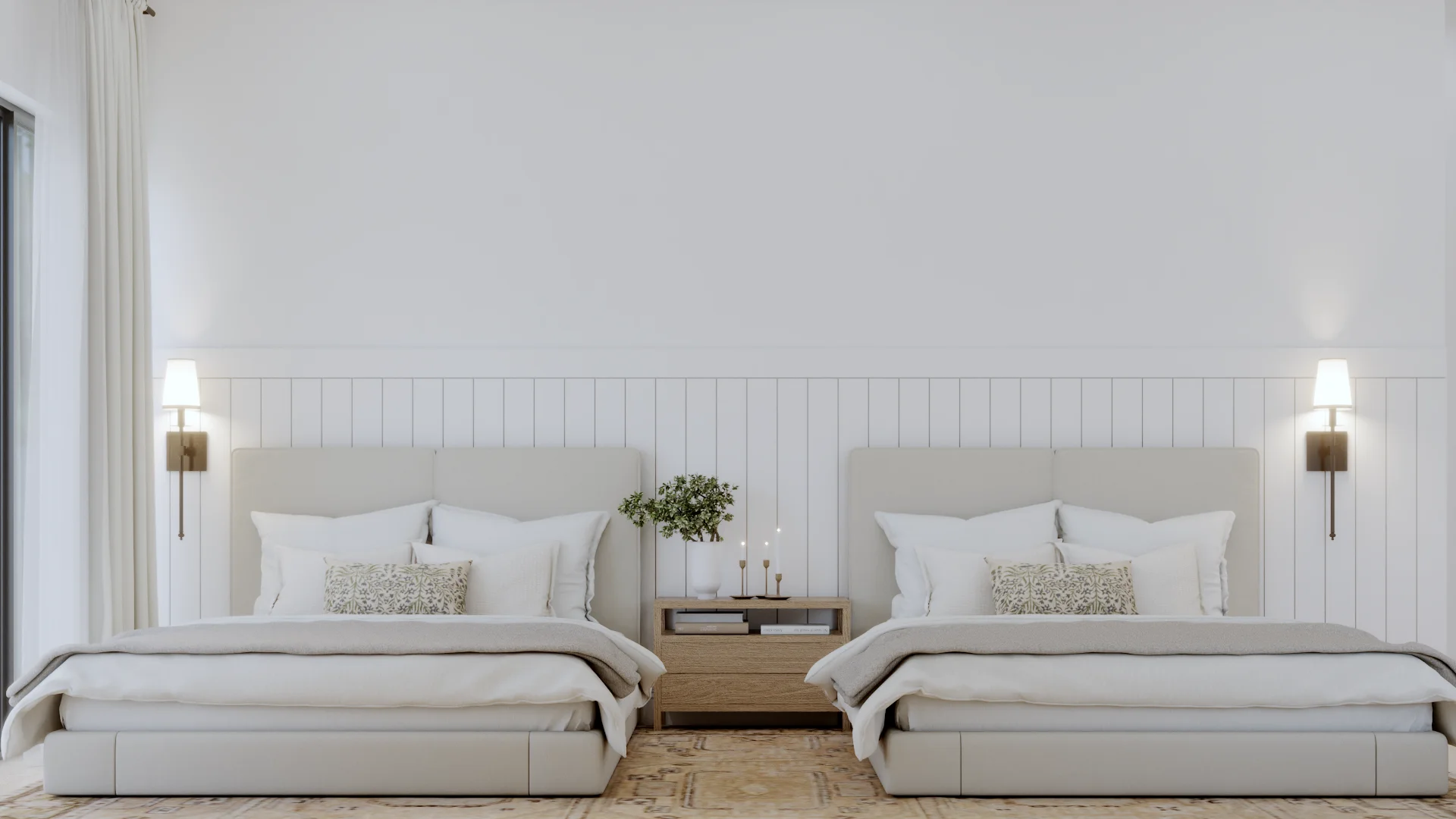 Symmetrical front view of two cream upholstered twin beds against white shiplap wall, centered oak rattan nightstand with plant and candles, bronze wall sconces