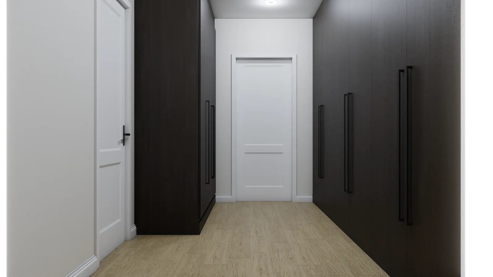 Corridor between dark wood wardrobe walls with black bar handles and white door at end