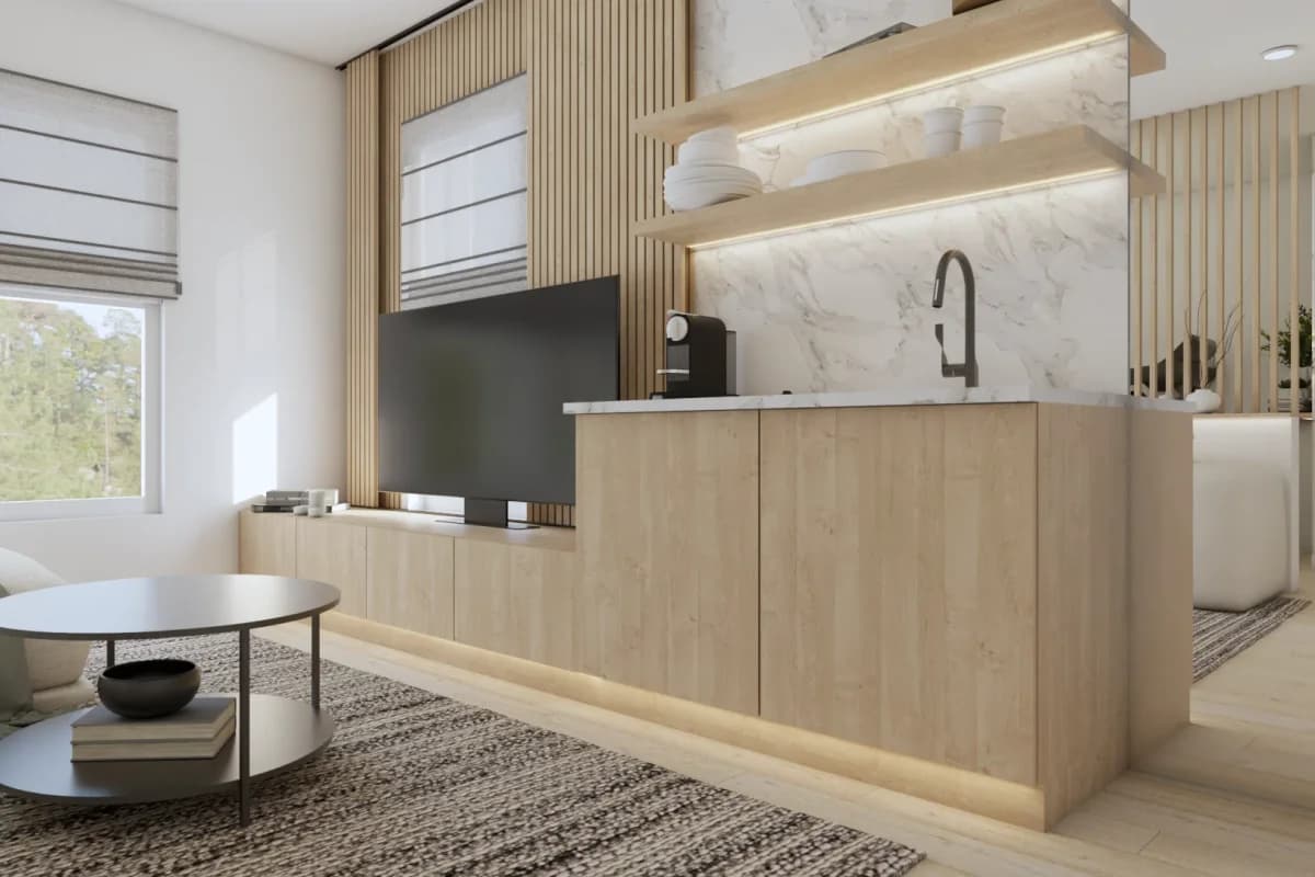 Light oak built-in wet bar with white marble backsplash, integrated sink and Nespresso coffee maker, LED-lit floating oak shelf, vertical wood slat wall panel, open-plan studio room