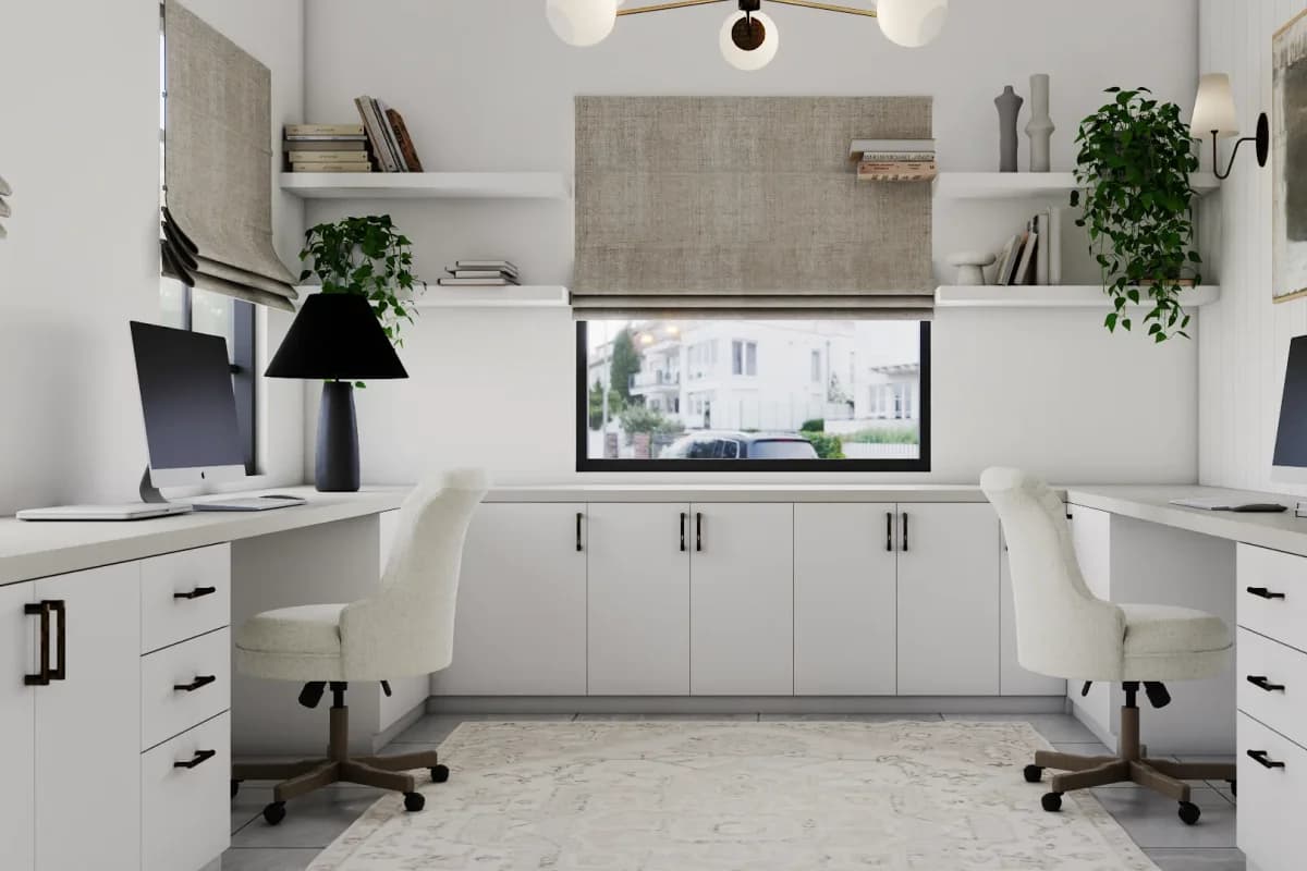 Dual built-in white desks on opposing walls flanking a center window, flat-panel cabinetry with matte black hardware, cream chairs and floating shelves above