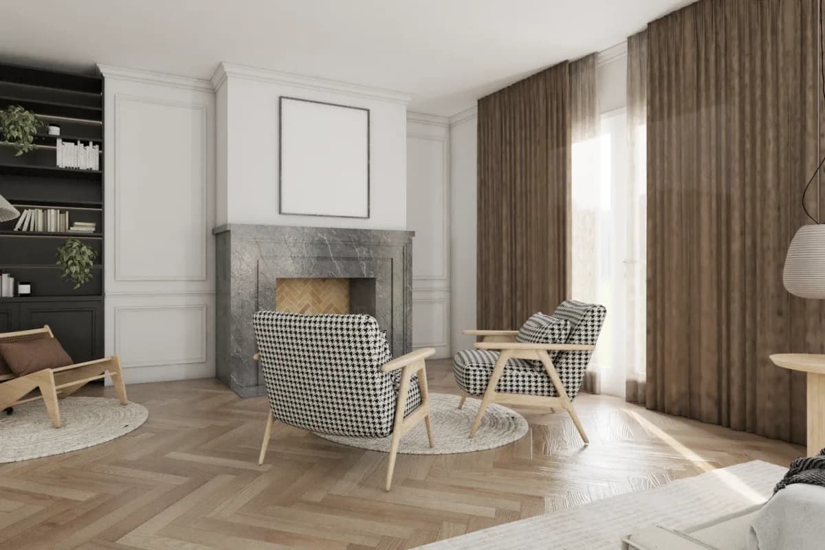 Dark sage green built-in bookcase flanking a gray marble fireplace with houndstooth chairs and herringbone oak floors in a formal living room