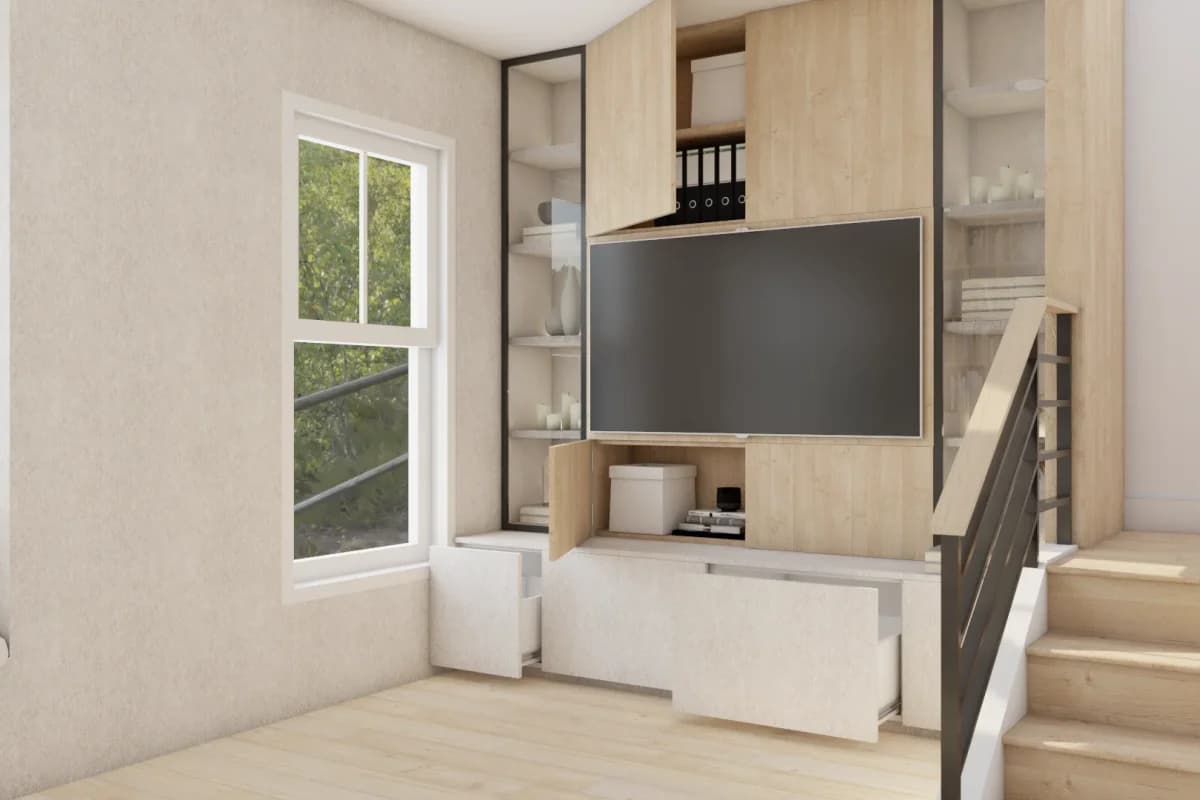 Compact oak media wall built into staircase landing with open shelves, upper cabinet, center-mounted TV, and white pull-out drawers below