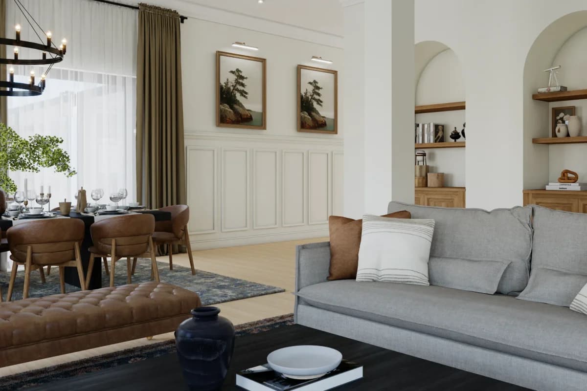 Open plan living room with arched plaster niche shelving in warm oak, gray sofa, cognac leather dining chairs, and botanical artwork