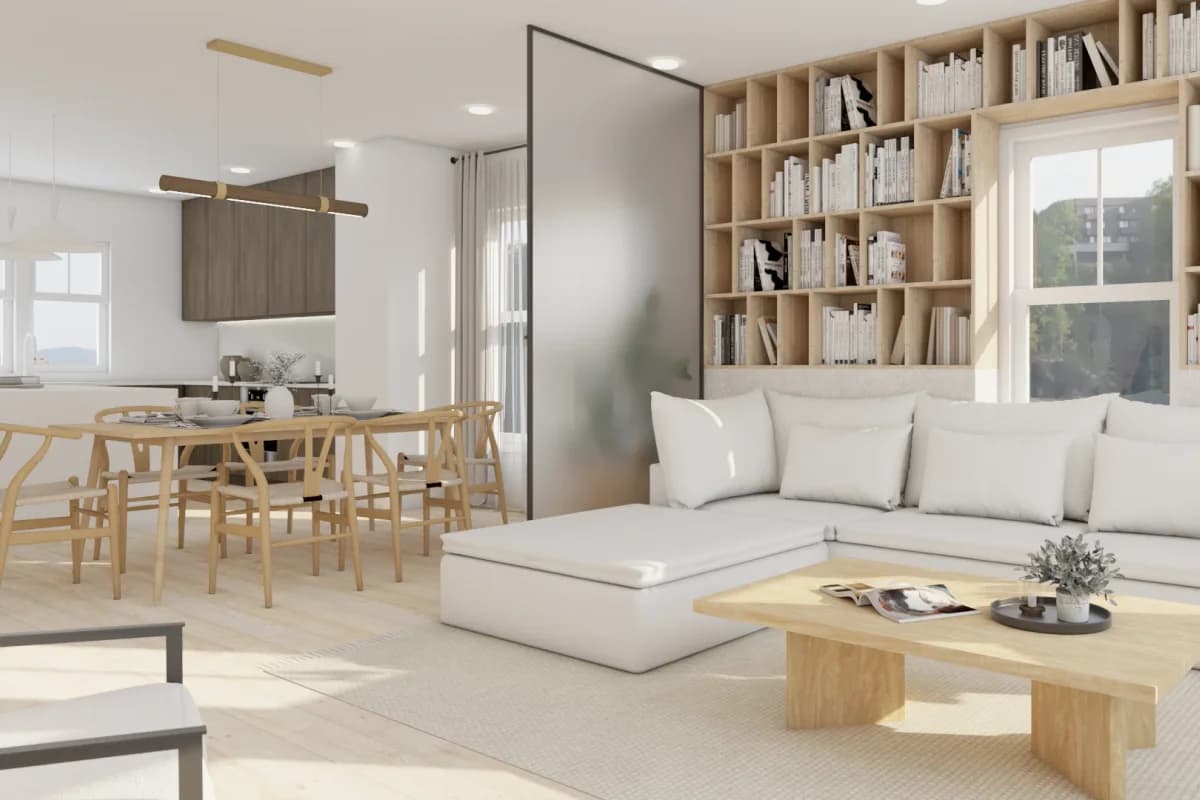 Open plan Scandinavian living and dining room with oak grid bookshelf wall, round dining table, wishbone chairs, and brass linear pendant light