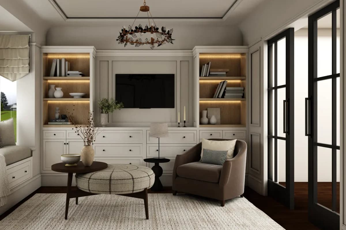 Transitional living room with LED-lit white built-in media bookcases flanking TV, lower drawers, taupe armchair, plaid ottoman, and wrought iron chandelier