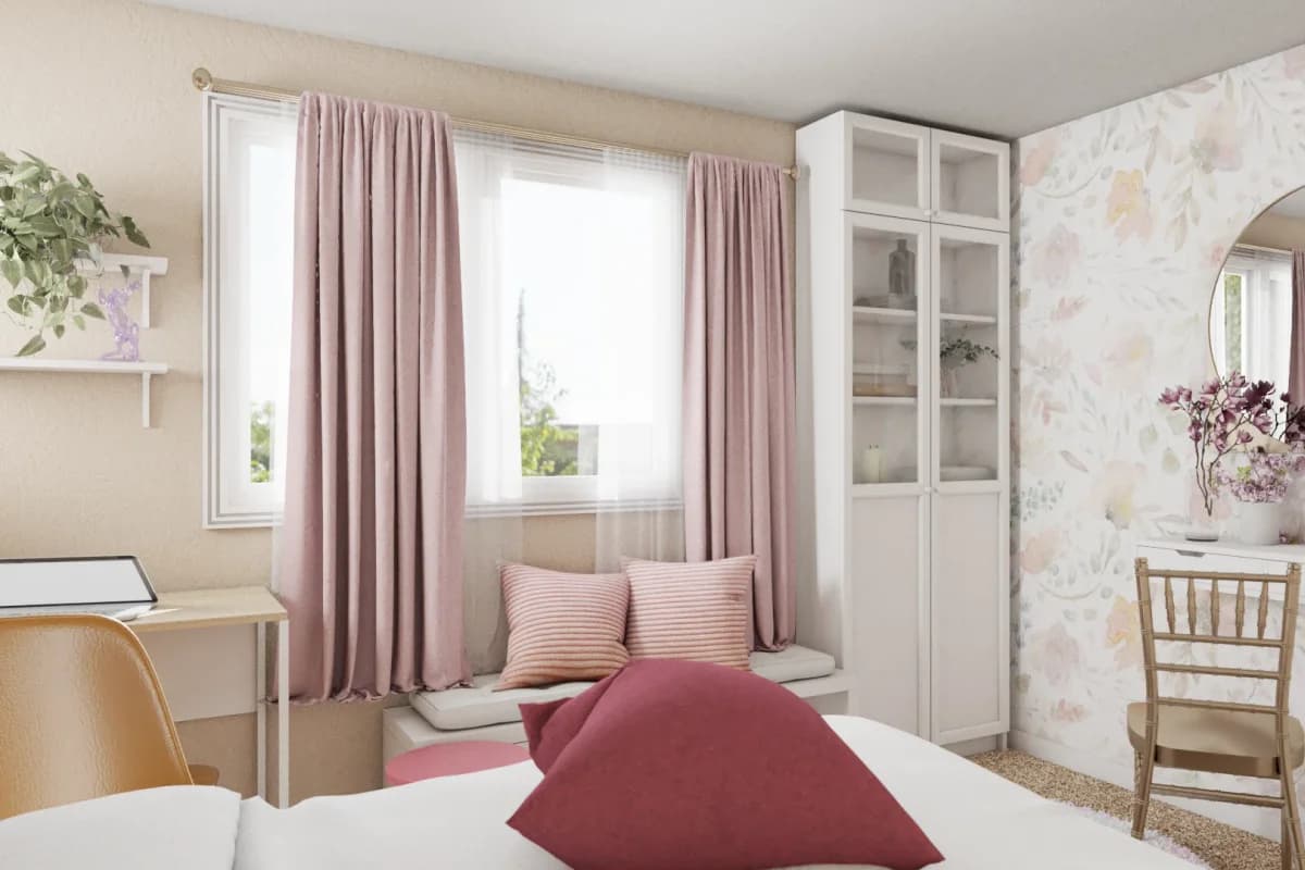 Girls bedroom with built-in pink window seat, striped cushions, pink curtains, white glass display cabinet, floral wallpaper, and round mirror
