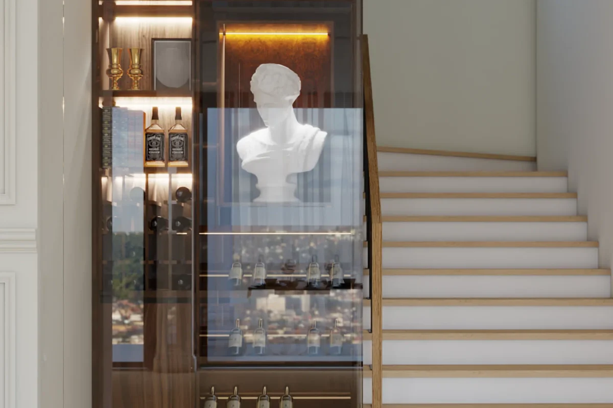 Glass-front walnut bar cabinet built into staircase wall with LED lighting, wine bottle racks, and a white classical bust sculpture