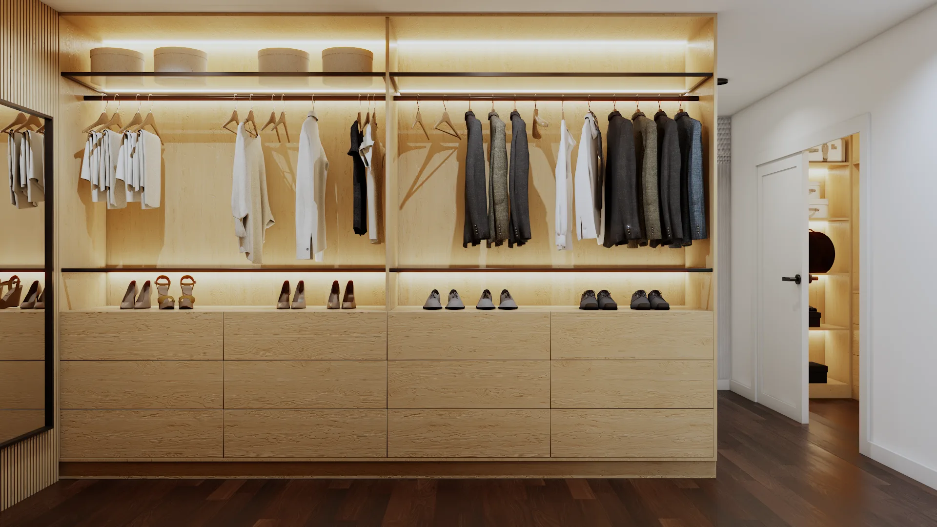 Full-width light oak wardrobe wall built-in with double hanging rods, center lit shoe display shelf, flat-front drawers,