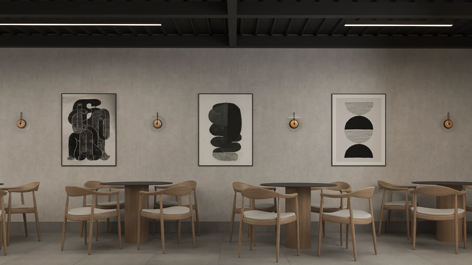 Industrial cafe seating wall with three large black and white abstract art prints in thin black frames on a gray concrete wall, brass disc wall sconces between each piece, natural oak wishbone-style dining chairs with cream cushions around dark round pedestal tables, exposed dark steel ceiling beams with linear LED strip lights