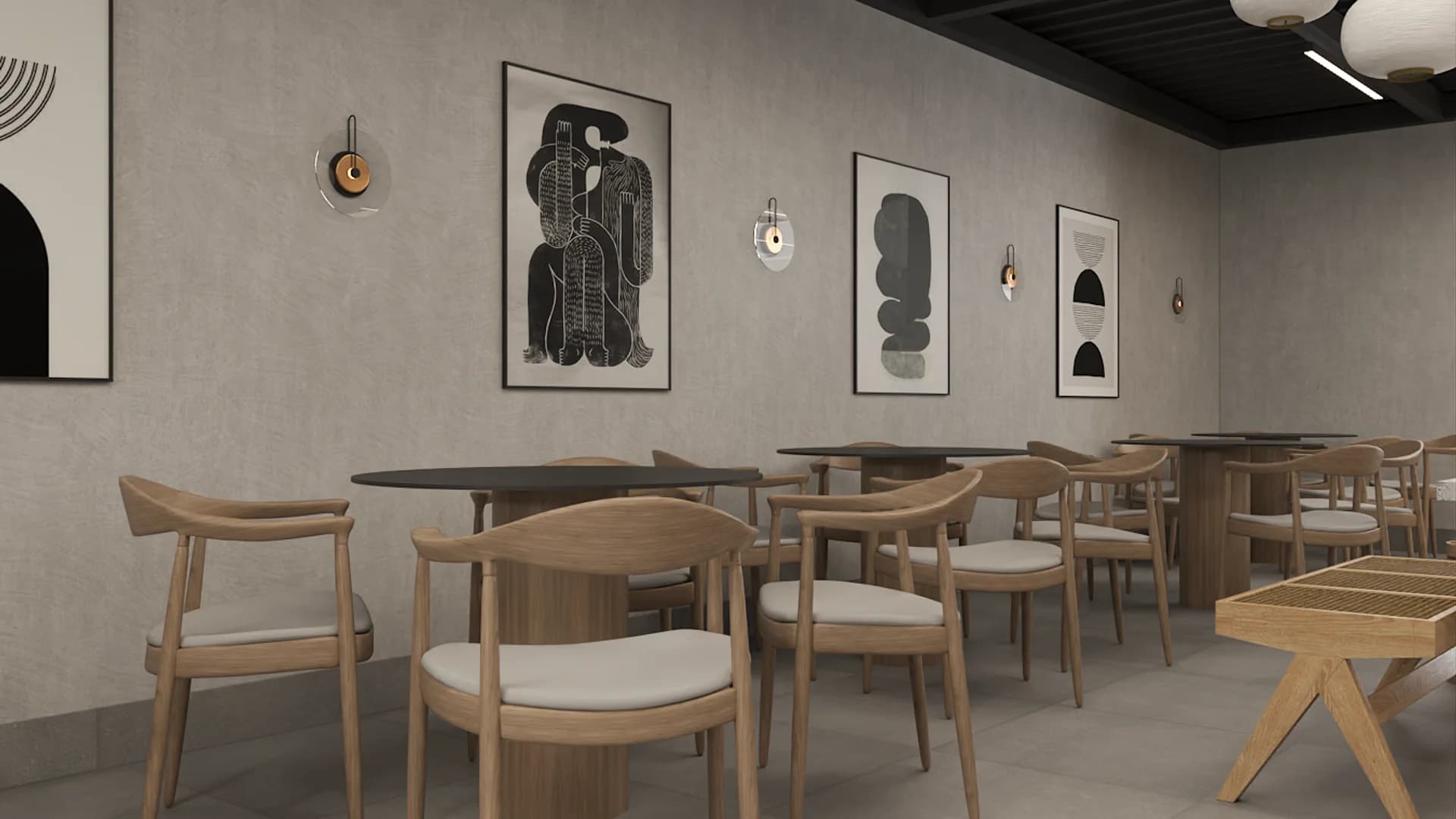 Cafe dining bay with oak round-back chairs, dark round tables, framed abstract art, and brass wall sconces