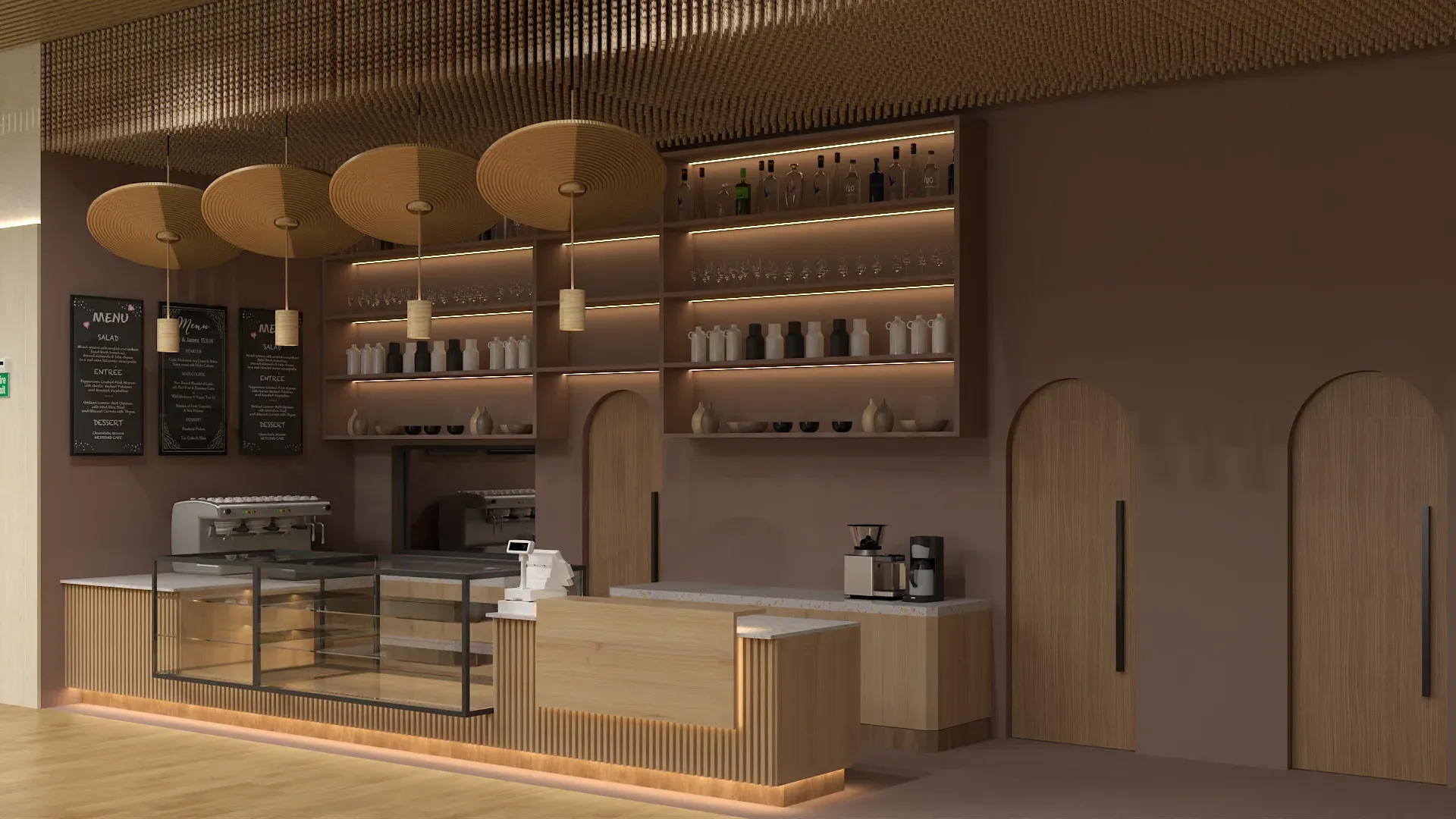 Cozy coffee bar with arched wood shelving unit displaying bottles and cups, warm brown mocha painted walls, four large woven disc pendant lights hung from rope ceiling detail, glass pastry display case, espresso machine on counter, natural wood base with LED underlight, and arched doorways designed by Debora Interiors