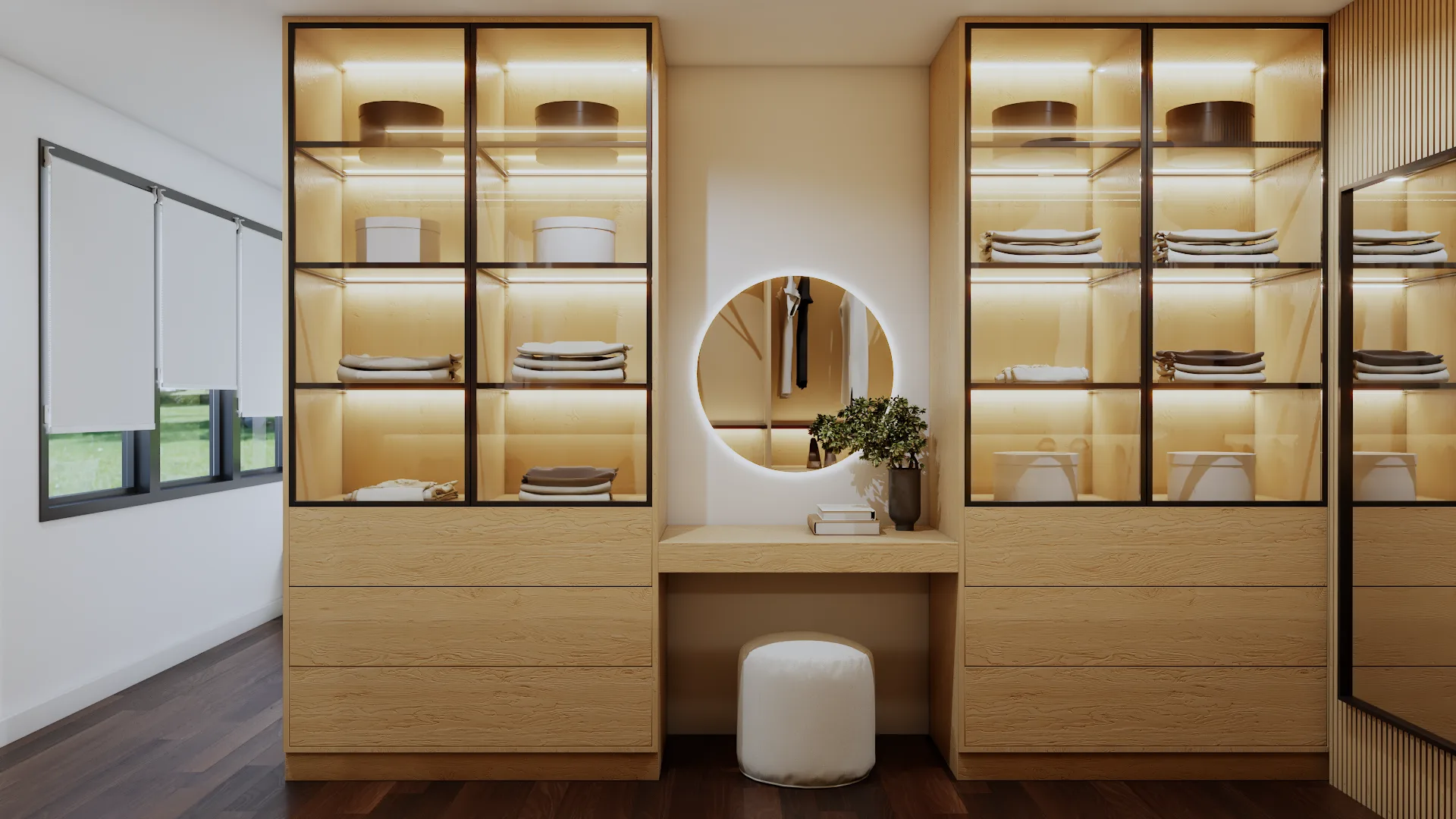 Oak dressing room with lit glass-front display cabinets flanking a round backlit vanity mirror and white pouf