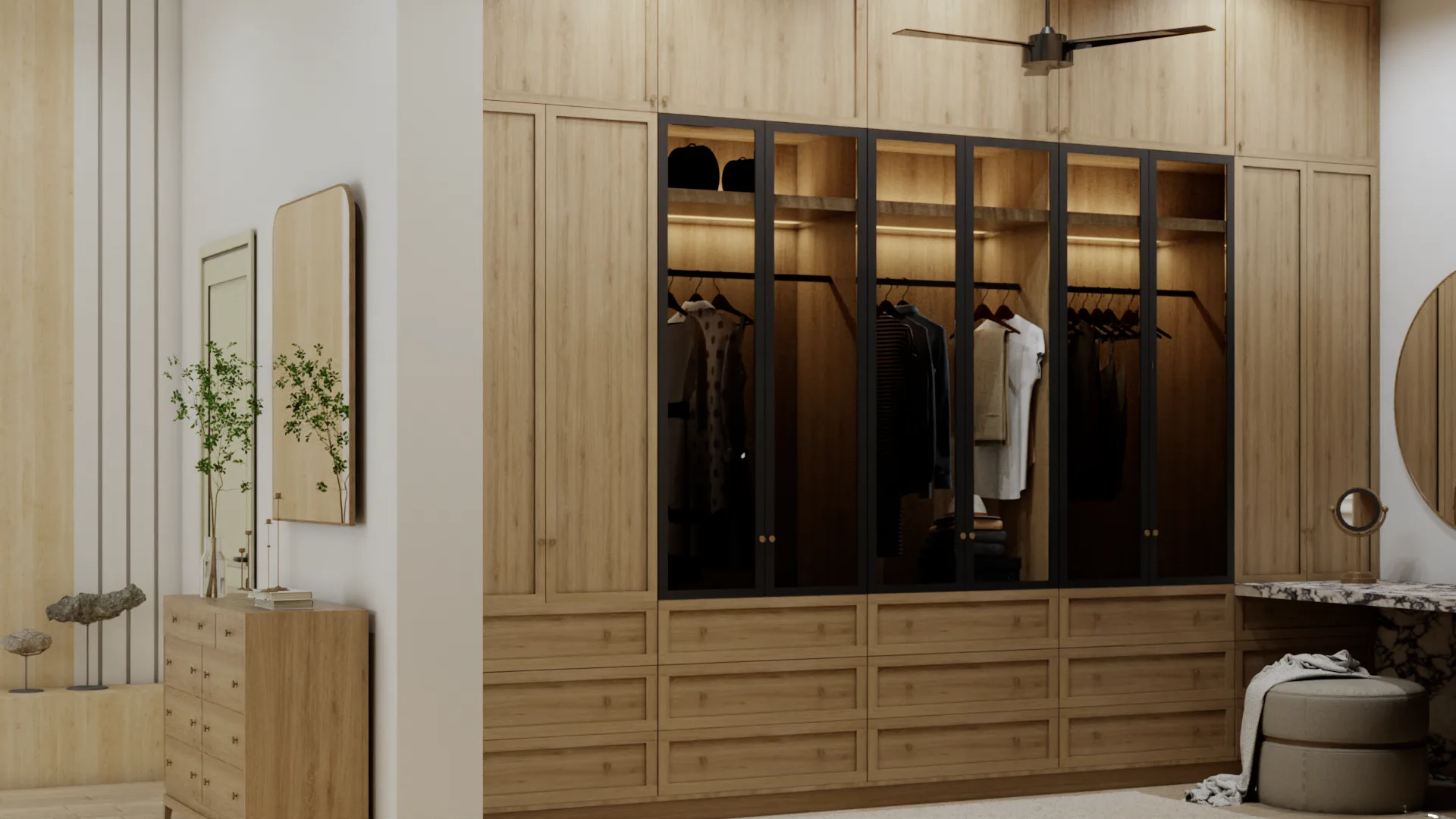 Floor-to-ceiling oak wardrobe with black steel glass doors, built-in hanging rails, and lower drawer bank in a custom master walk-in closet