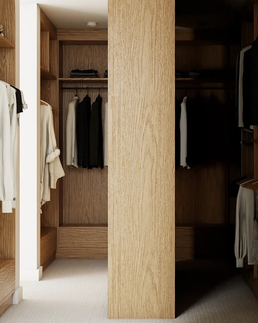 Close-up of oak column with hanging bay showing garments on wood hangers