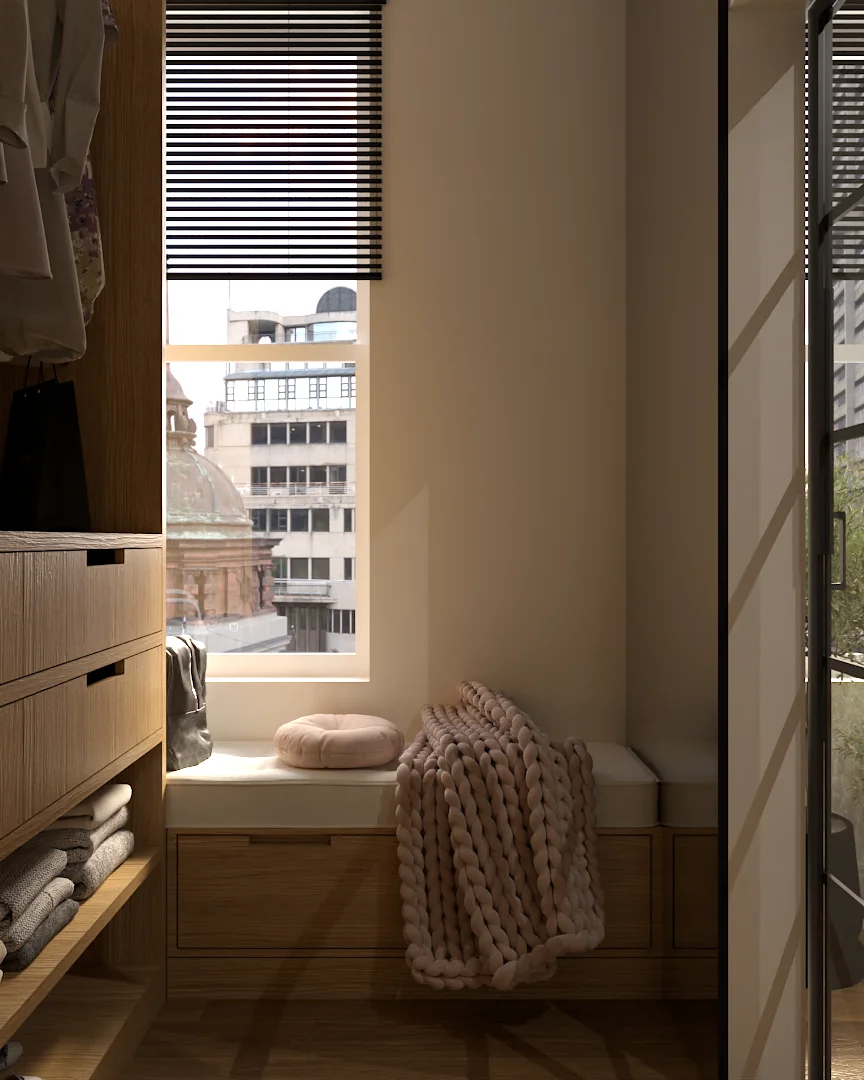 Walk-in closet window seat with round cushion, chunky blush knit throw, city skyline through venetian blinds, oak drawers and folded linens on open shelves