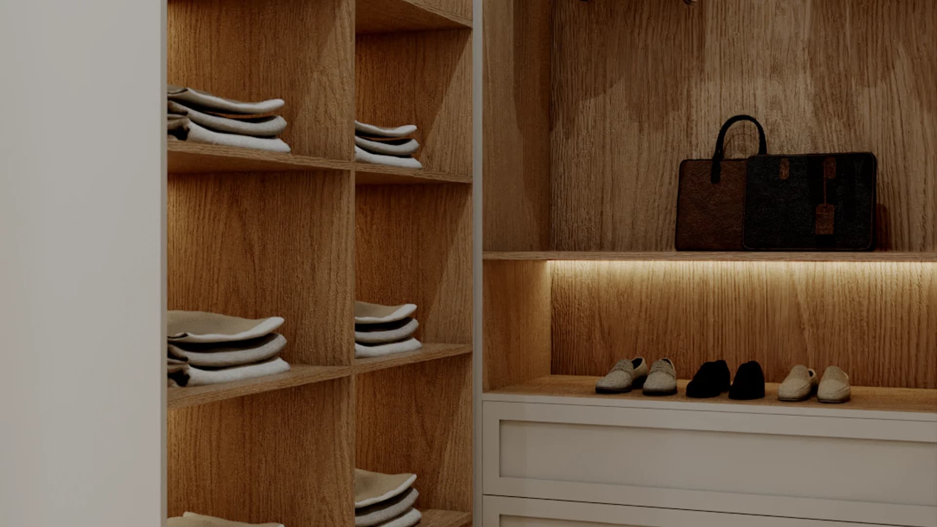 Closet detail with folded linen shelves in oak cubbies, LED-lit shoe display shelf, and designer bag on oak counter