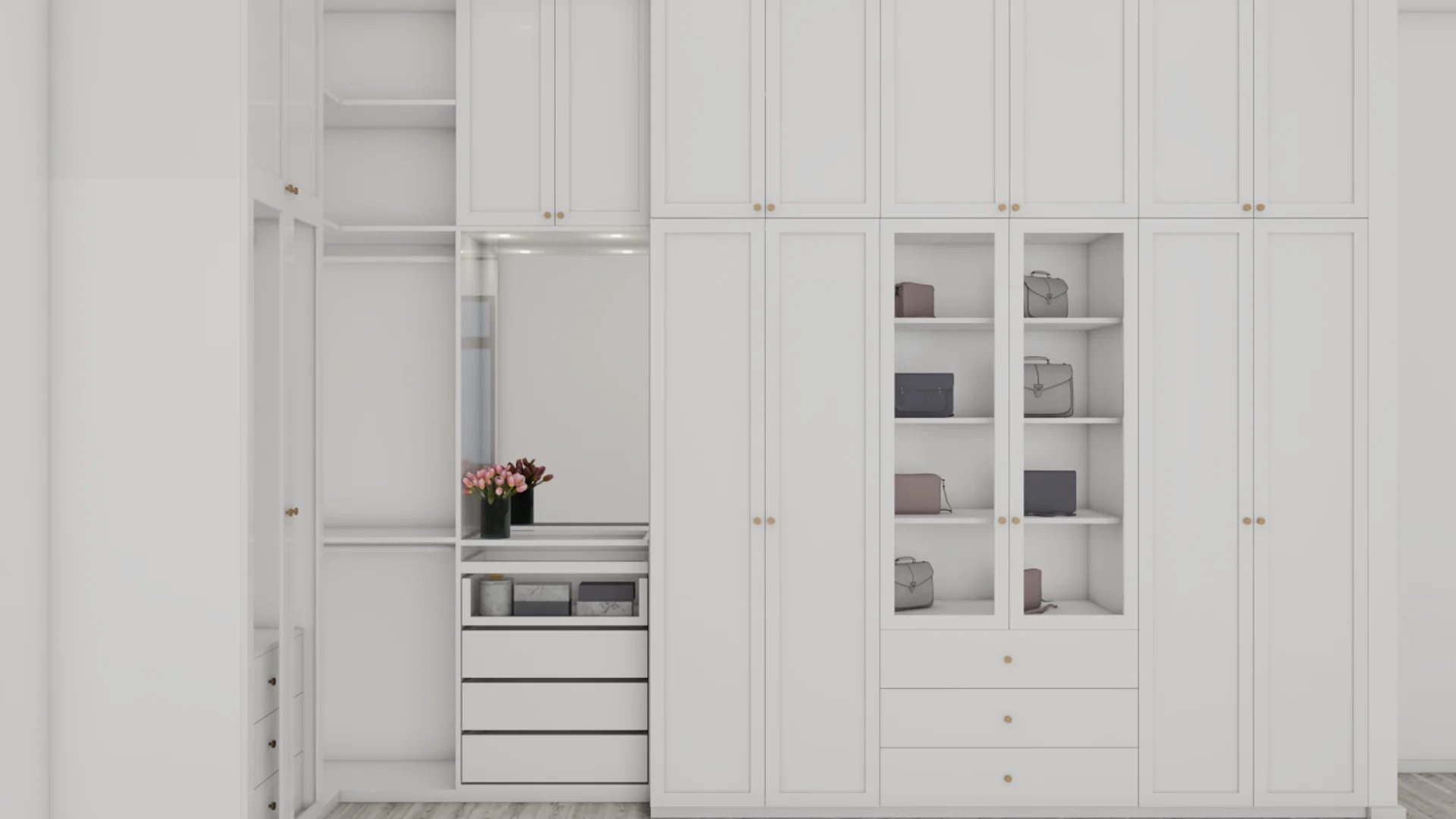 White shaker built-in closet with floor-to-ceiling cabinetry, brass hardware, glass-front display shelves for handbags, and stacked drawers. Design by Debora, an online interior design service.