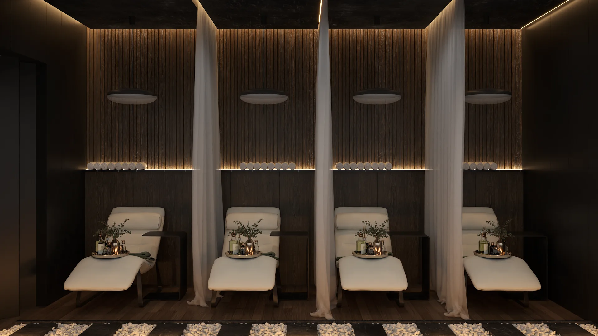 Curtained white chaise lounge bays with dark slat walls, LED lighting, and pebble floor border