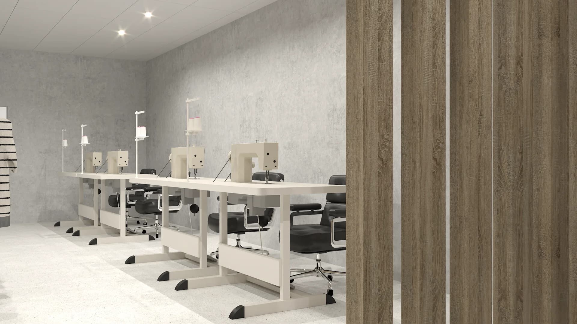 Tailoring workshop with industrial sewing machines on white tables, black chairs, oak slat divider