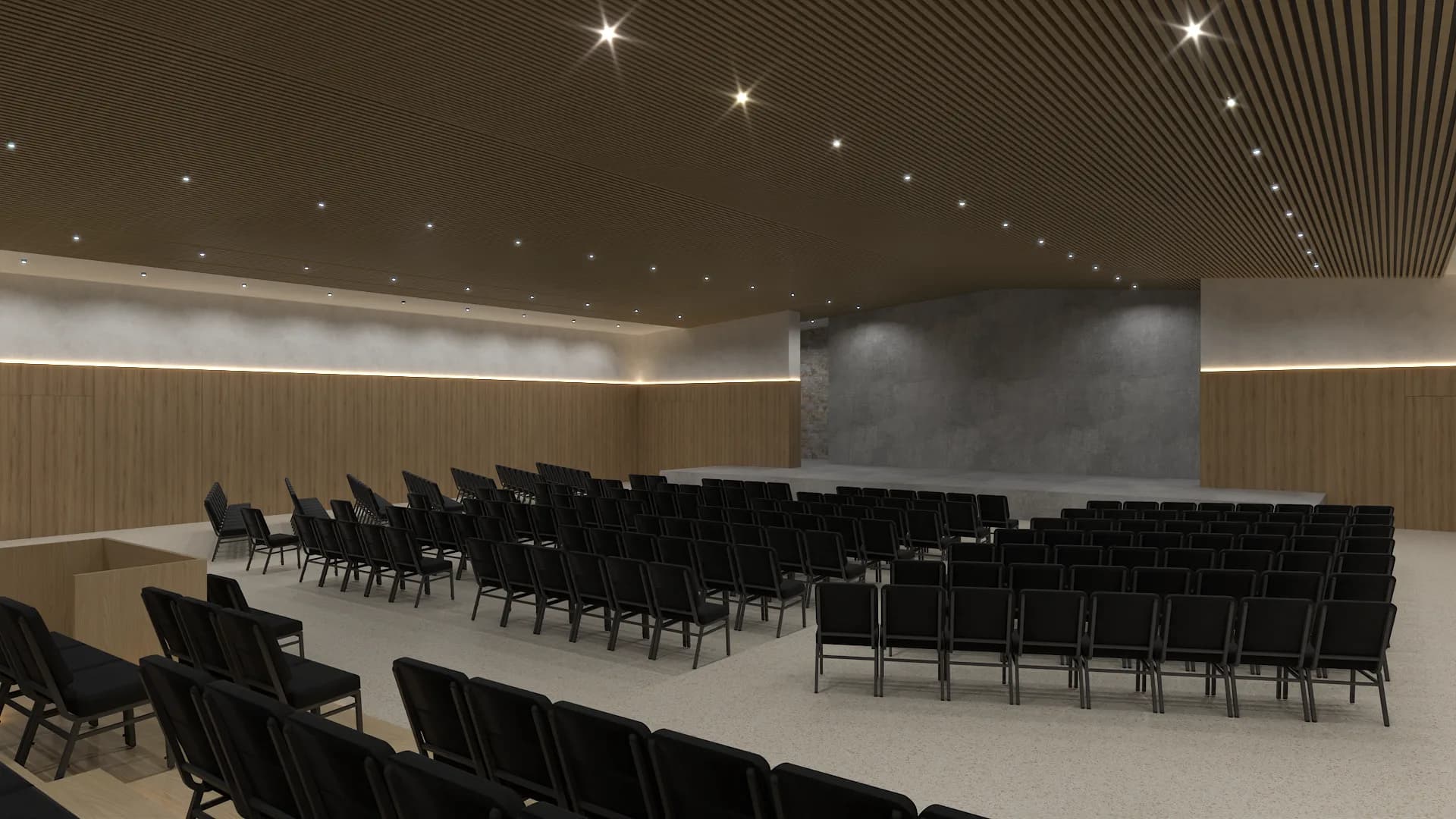 Flat floor auditorium layout with black chairs, wood slat ceiling, and recessed spots