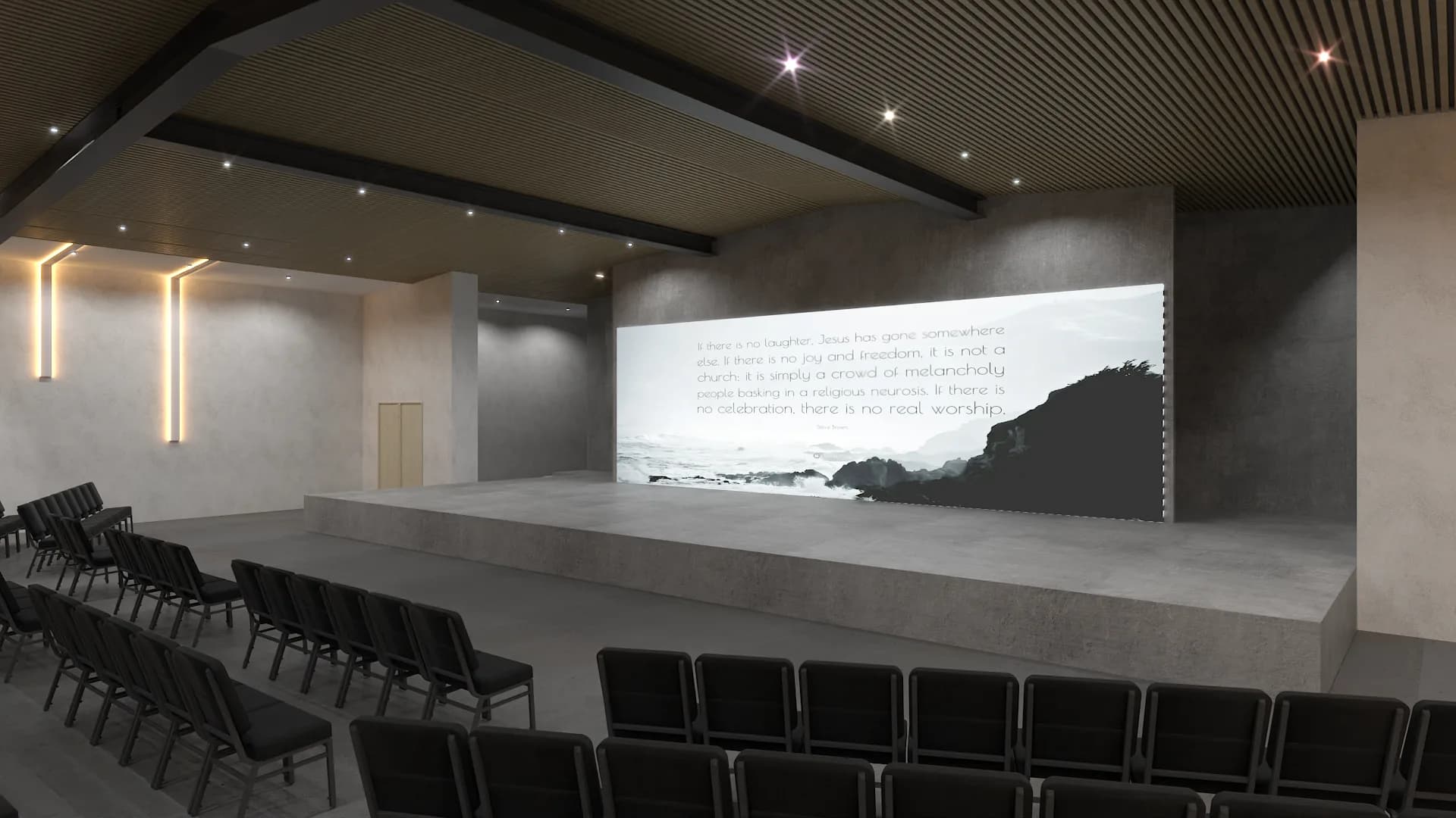 Side angle of concrete stage with projection screen, oak wall, and black seating rows