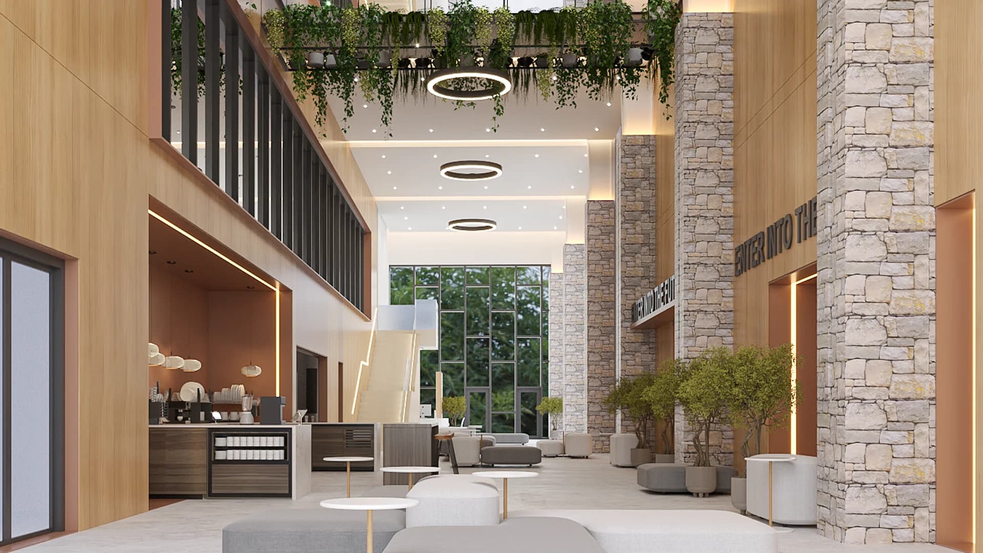 Double-height lobby with stone columns, hanging greenery, and gray lounge seating
